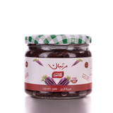 Glass jar of golden Carrot Jam from BOSTAN SETELHOSN on a wooden board, made with natural Egyptian carrots.