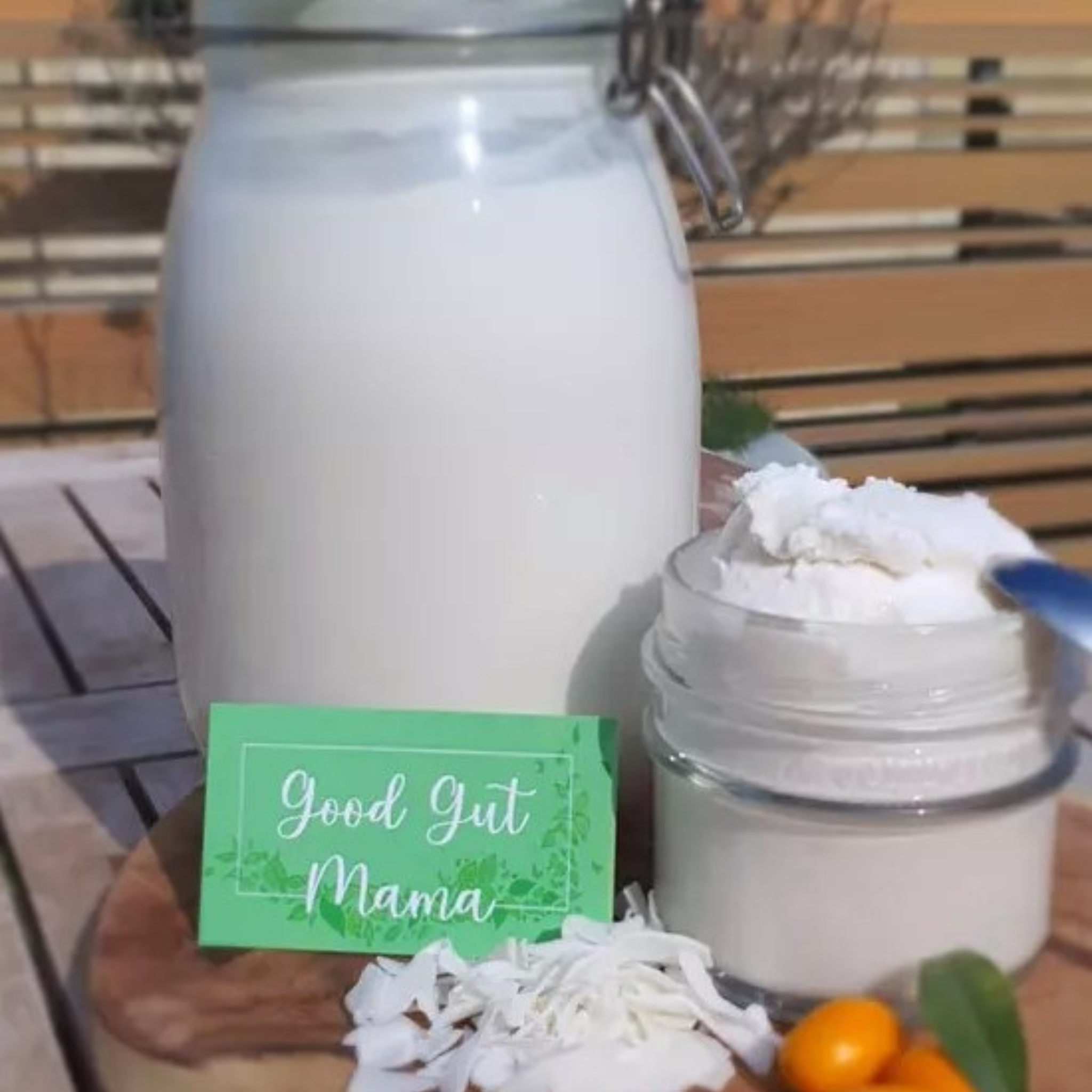 Coconut Yogurt from Good Gut Mama, available at Elmeraki, displayed in a jar with fresh berries and granola.
