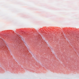 Premium O-Toro Bluefin Tuna Sashimi cut from Crazy Tuna, showcasing rich marbling, available at El Meraki Egypt.