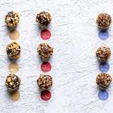 DANSnack Mixed Date Bites – 12-piece variety pack (Date, Peanut, OJ, Almond Chia) with natural toppings, made in Egypt