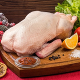 Fresh Duck by Tabi3y, available at Elmeraki, displayed ready for cooking with herbs and spices.