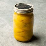 Jar of smooth Pickled Lemon Paste by BOSTAN SETELHOSN, a fermented probiotic condiment from Egypt.
