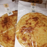 Fateer (Pie) by Tabi3y, available at Elmeraki, displayed with a flaky crust and a variety of fillings.