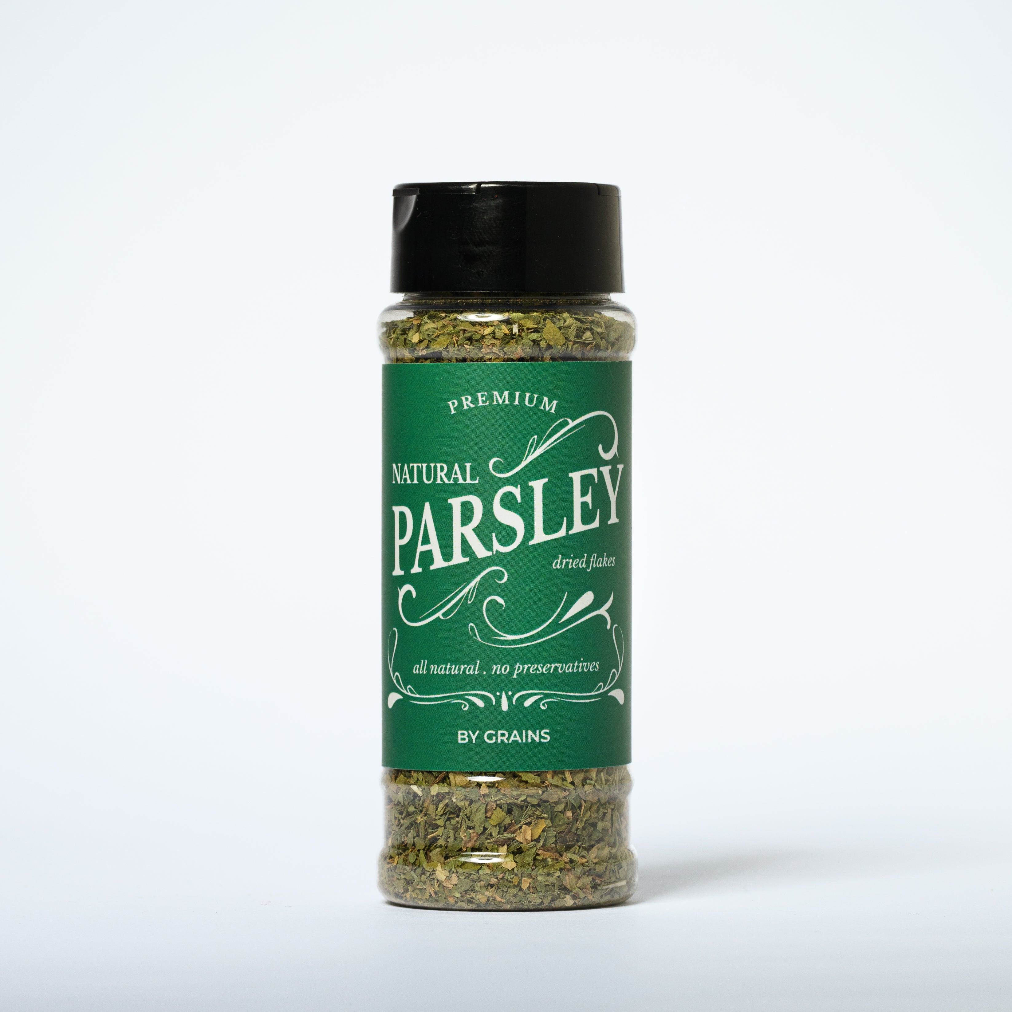 Grains Natural Parsley Flakes 110g - Premium dried parsley flakes with vibrant green color in a clear glass jar | رقائق البقدونس الطبيعي من جرينز ١١٠ جرام - رقائق بقدونس مجفف عالية الجودة بلون أخضر نابض بالحياة في وعاء زجاجي شفاف