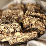 Nourish Me Crackers from Good Gut Mama, available at Elmeraki, displayed in a bowl with nuts and seeds