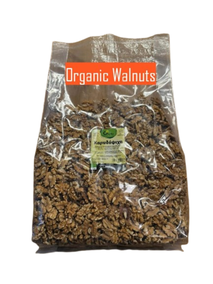 Whole and halved Ola Bio Organic Walnuts from Greece in a bowl, sold at El Meraki store.