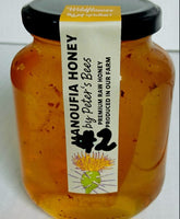 Jar of Pure Elmonifya Honey, a golden natural Egyptian honey sold at El Meraki store.