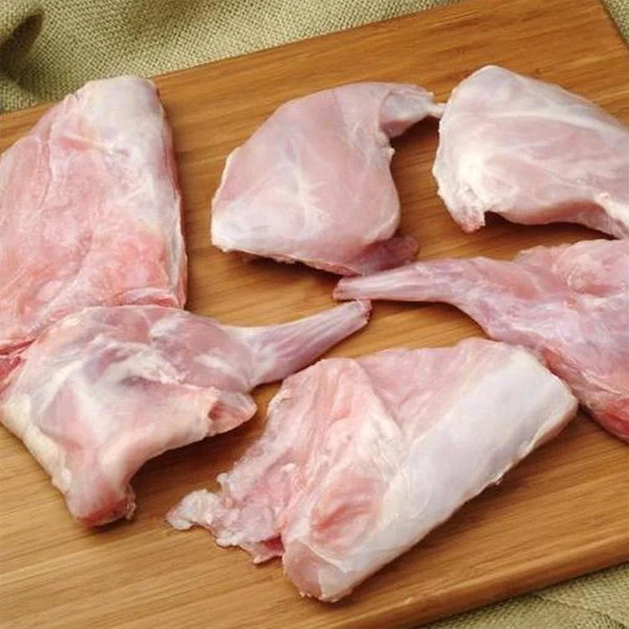 Fresh Rabbit by Tabi3y, available at Elmeraki, displayed ready for cooking with herbs and spices.