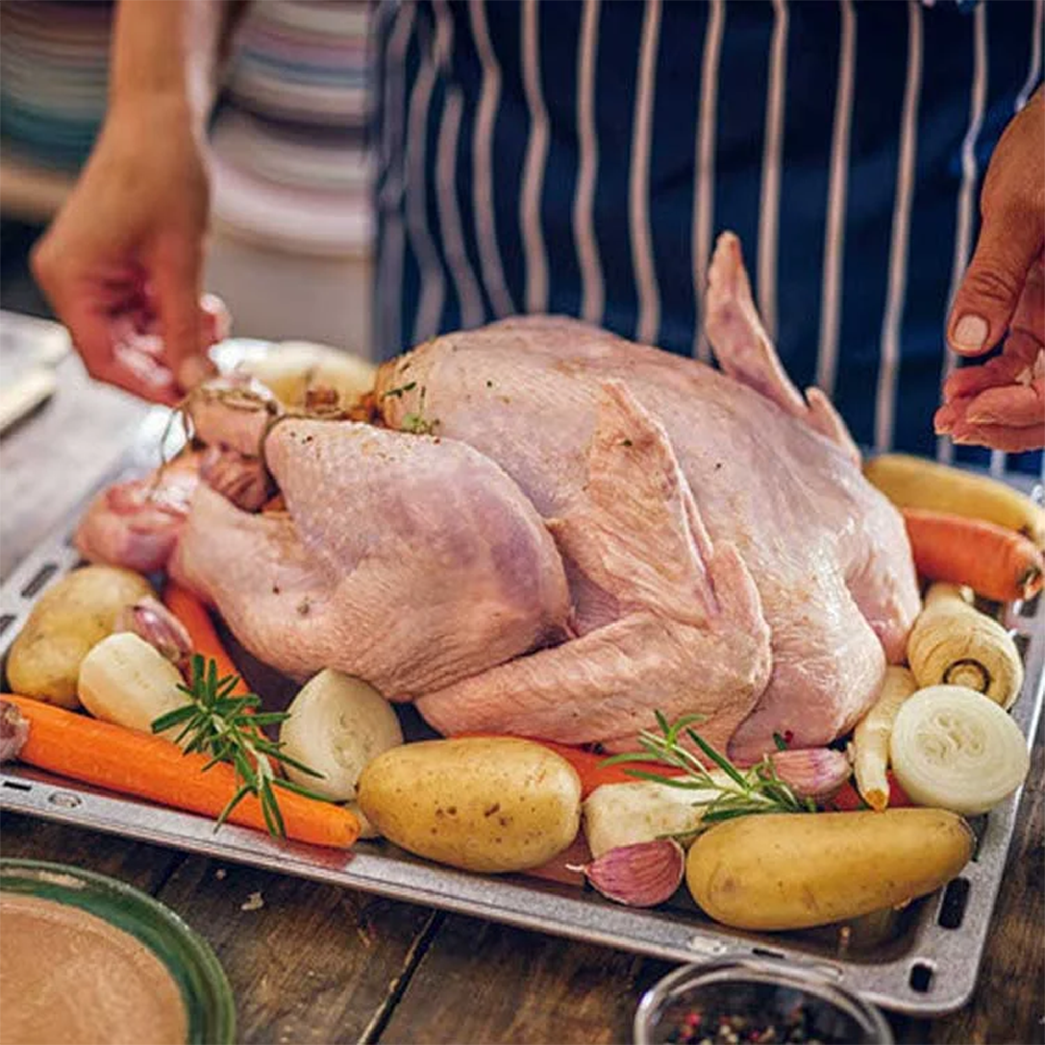 Fresh Turkey by Tabi3y, available at Elmeraki, displayed ready for cooking with herbs and spices.