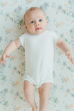 Under the Nile Organic Ribbed White Girls Bodysuit made from soft stretchy cotton.