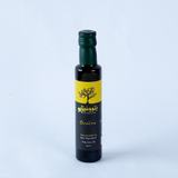 Small bottle of Coratina Olive Oil from Bostan Set El Hosn, 500 gm, featuring a green and white checkered label with both Arabic and English text