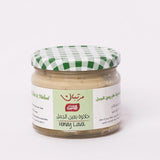 Jar of Honey Lava with Walnut from Bostan Set El Hosn, 350 gm, featuring a green and white checkered lid and a label with both Arabic and English text