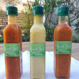 Fermented Piri-Piri Sauce from Good Gut Mama, available at Elmeraki, displayed in a bottle with fresh chili peppers.