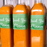 Fermented Piri-Piri Sauce from Good Gut Mama, available at Elmeraki, displayed in a bottle with fresh chili peppers.