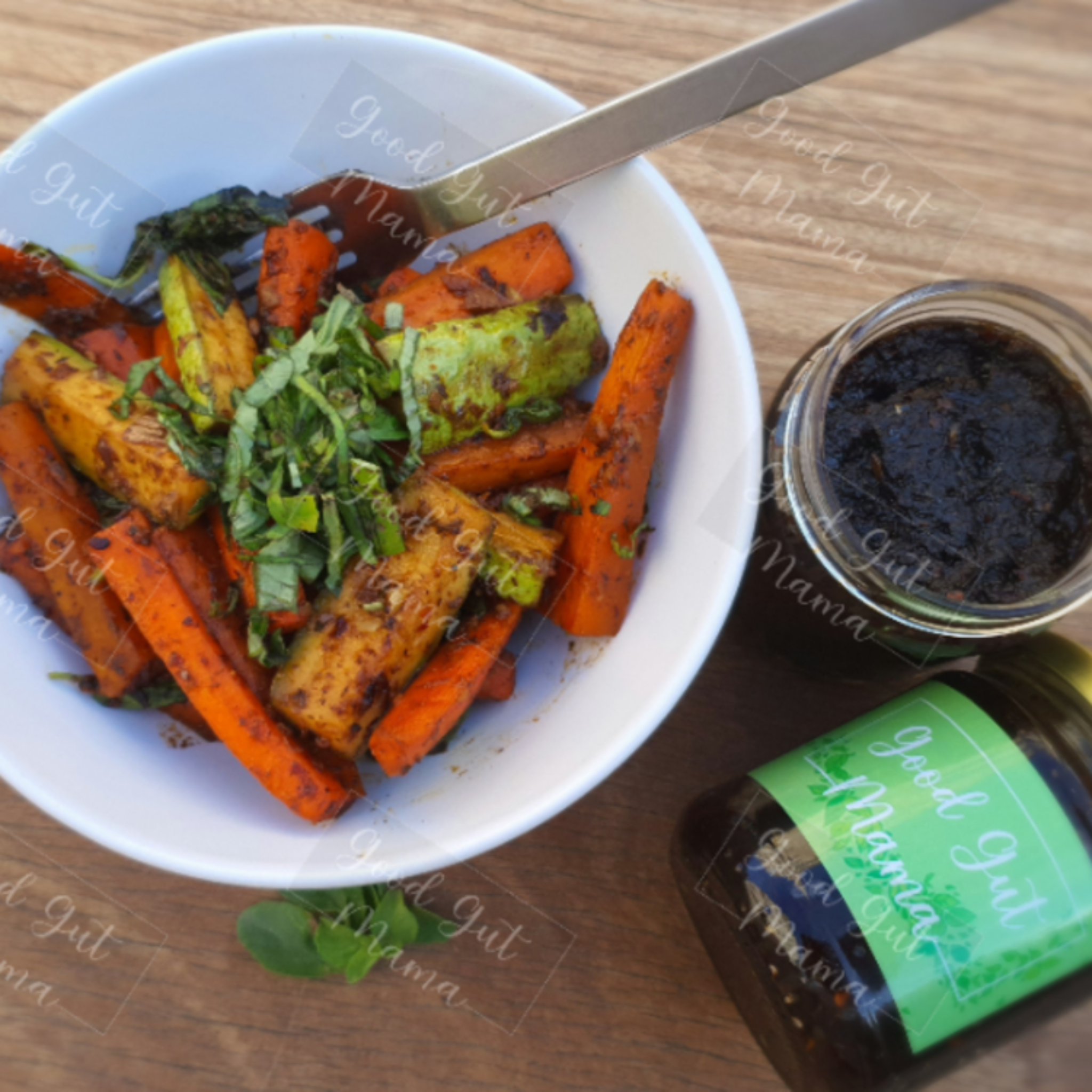 Nam Prik Pao (Thai Chilli Jam) from Good Gut Mama, available at Elmeraki, displayed in a jar with fresh chili peppers and herbs.