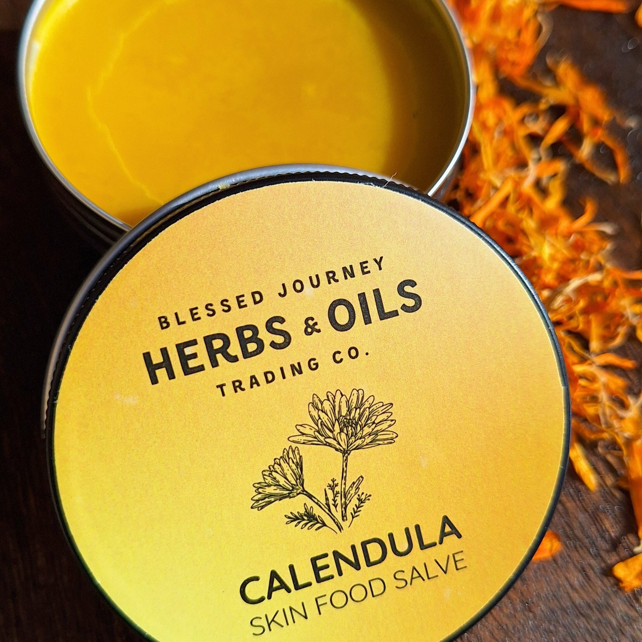 A jar of Blessed Journey Calendula Salve from El Meraki, a natural healing balm made with organic calendula and local beeswax.