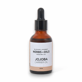 Blessed Journey Jojoba Oil, a golden natural oil for balancing skin moisture and conditioning hair, available in Egypt.