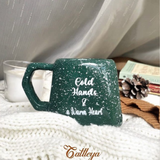 The Cattleya Egypt Handcrafted Christmas Ceramic Mugs Collection, featuring red, green, and frost designs.