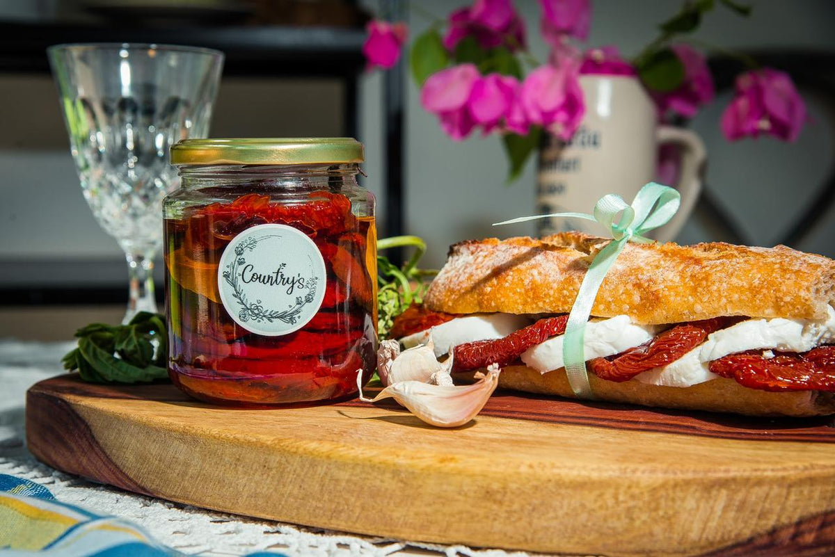 Jar of Country's Dried Tomatoes Spread with sun-dried tomatoes visible, from El Meraki store.
