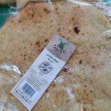 Falahy Bread by Tabi3y, available at Elmeraki, displayed fresh and fluffy with a variety of bread types.