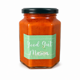 Fermented Piri-Piri Sauce from Good Gut Mama, available at Elmeraki, displayed in a bottle with fresh chili peppers.