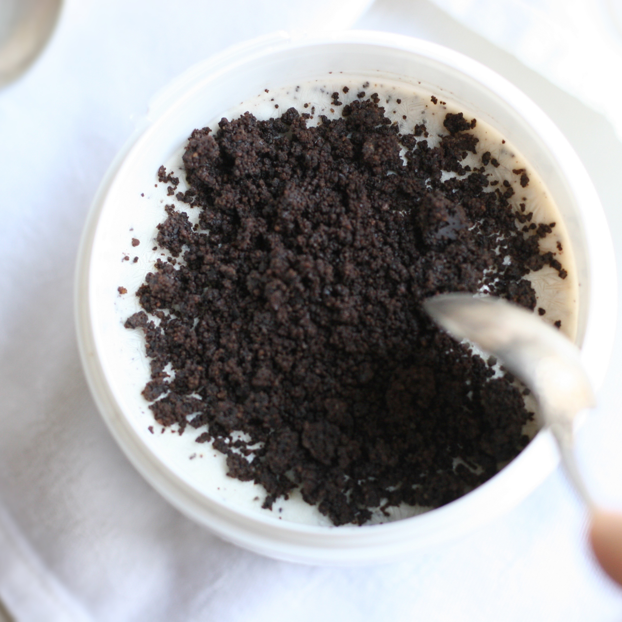 assortment of 10 ice cream flavors in tubs – chocolate, mango, pistachio, matcha, and more.