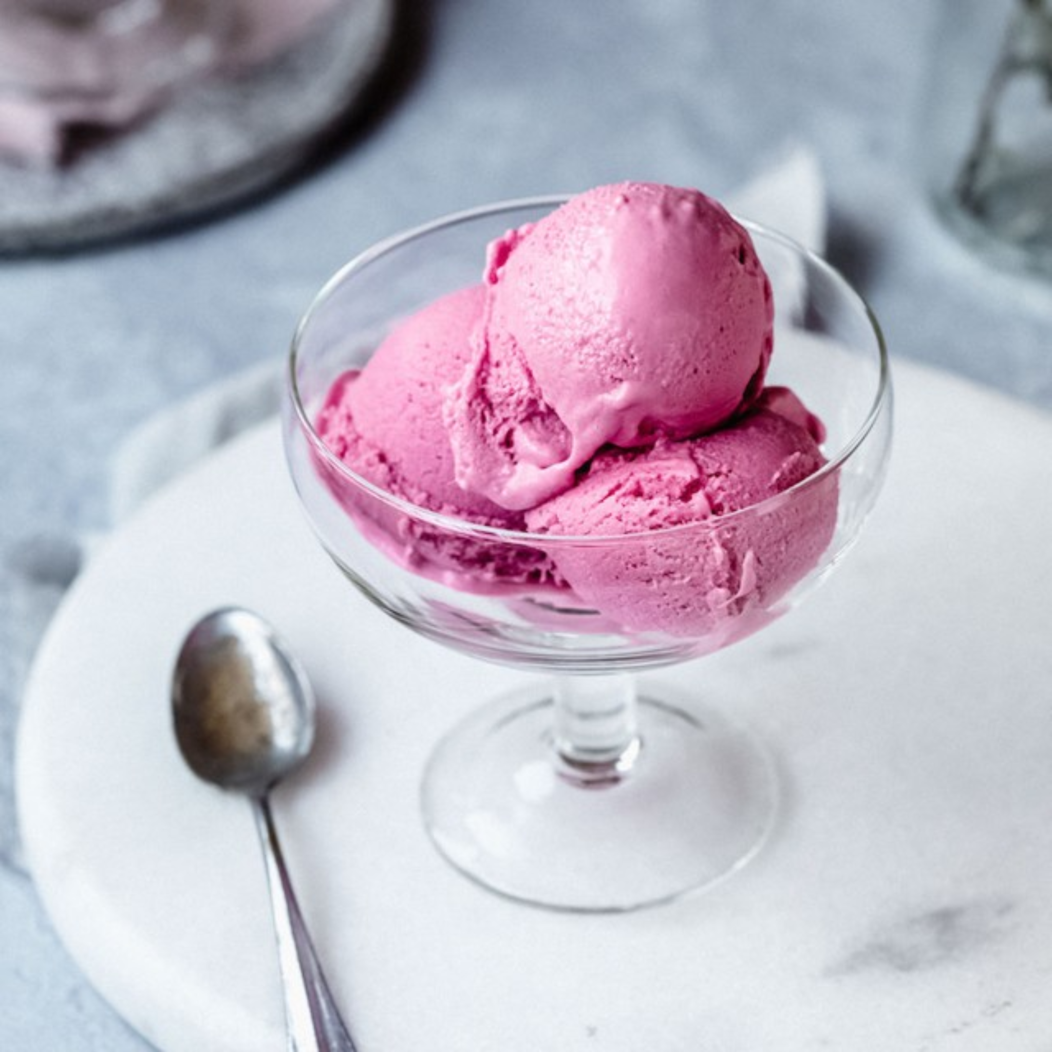 assortment of 10 ice cream flavors in tubs – chocolate, mango, pistachio, matcha, and more.