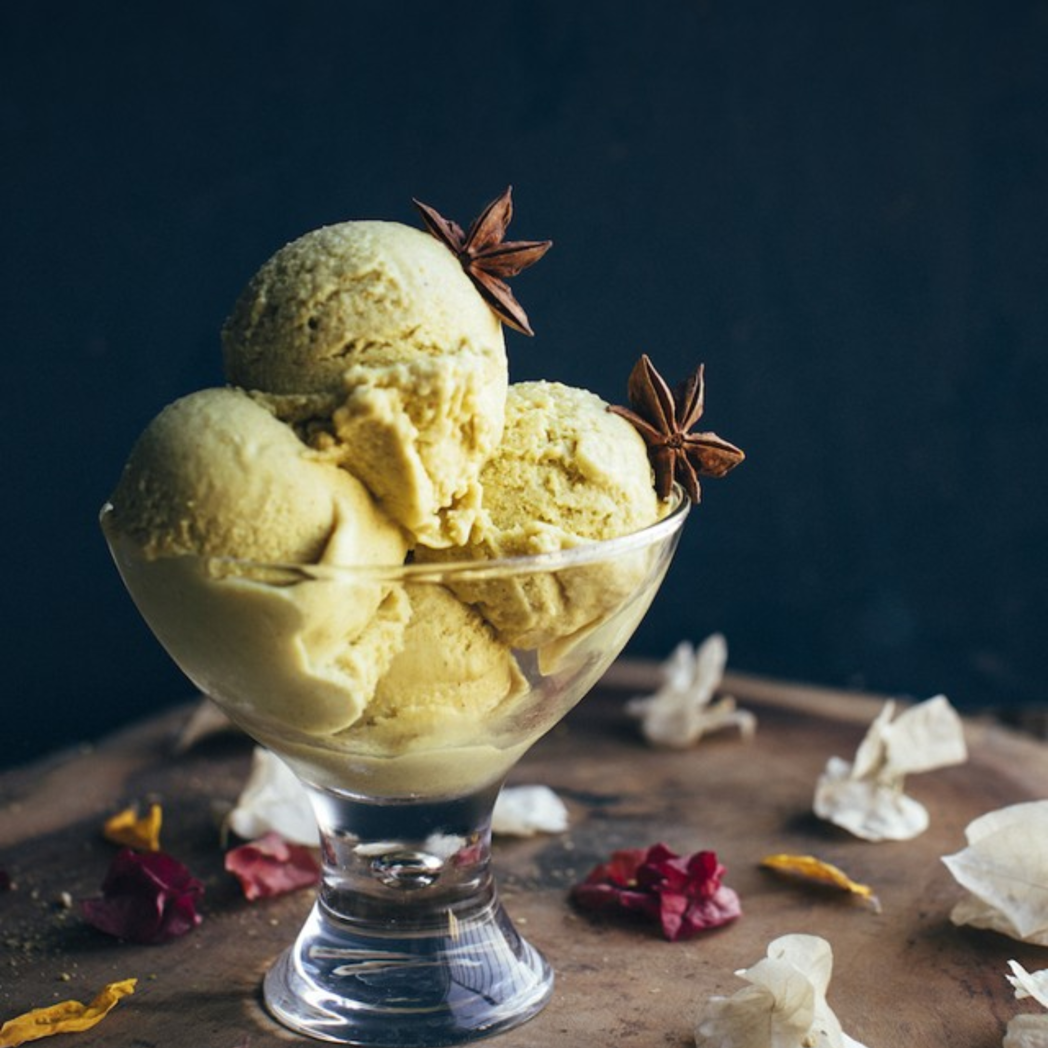 assortment of 10 ice cream flavors in tubs – chocolate, mango, pistachio, matcha, and more.