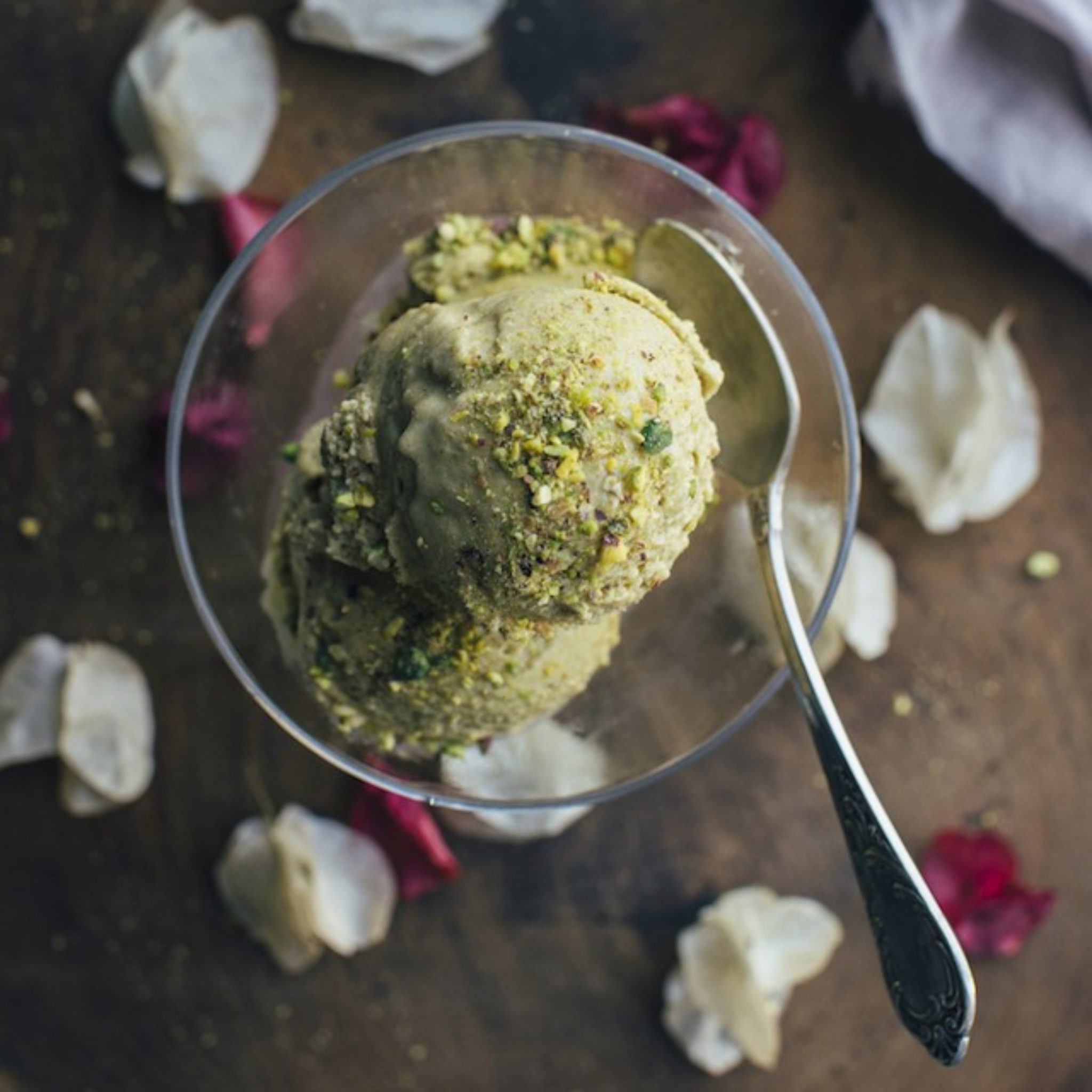 assortment of 10 ice cream flavors in tubs – chocolate, mango, pistachio, matcha, and more.