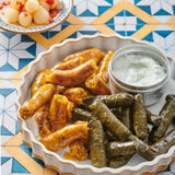 A plate of fried Komm El Dikka Stuffed Beef Mombar, a traditional Egyptian sausage, from El Meraki.