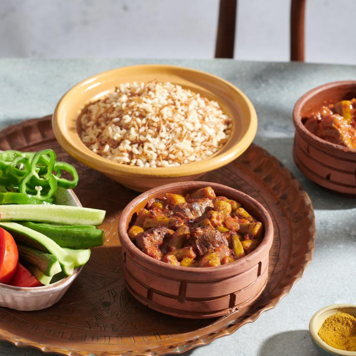 A bowl of fluffy, chef-prepared Komm El Dikka White Rice, a versatile frozen side dish from El Meraki.