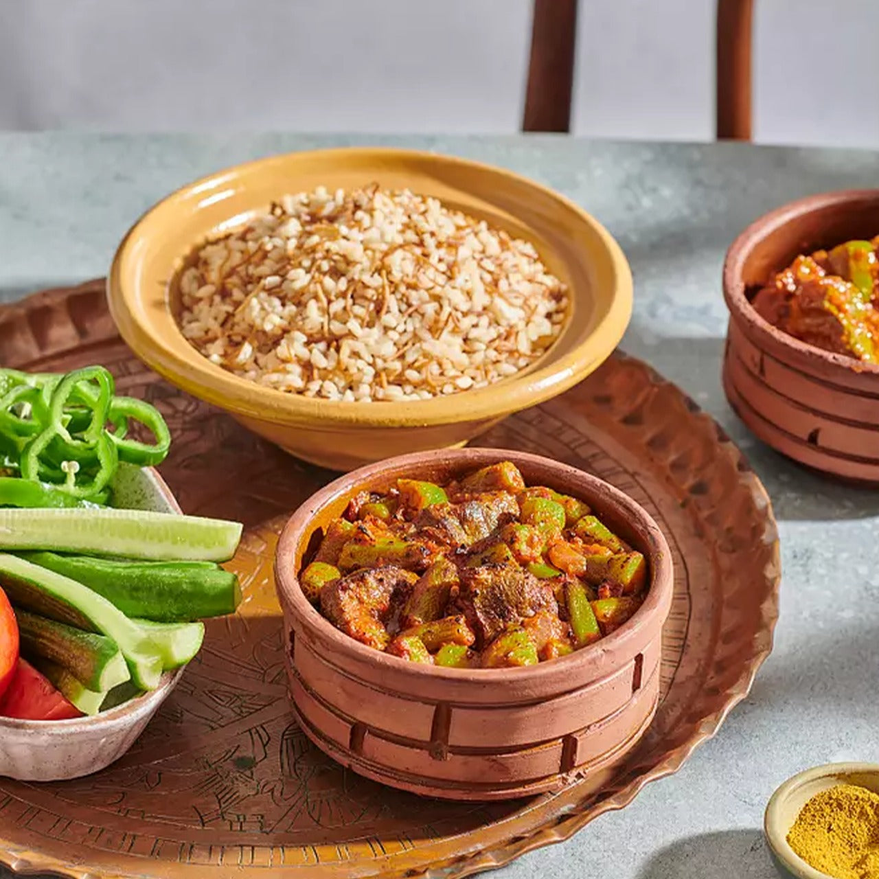 A traditional Egyptian Okra Tajen with Baladi Meat in a pot, a frozen prepared meal from Komm El Dikka at El Meraki.