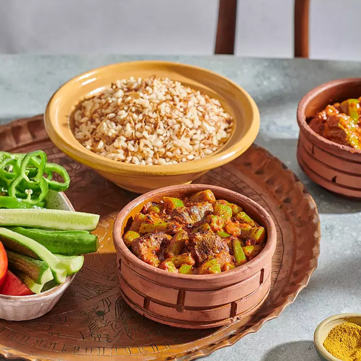 A traditional Egyptian Okra Tajen with Baladi Meat in a pot, a frozen prepared meal from Komm El Dikka at El Meraki.