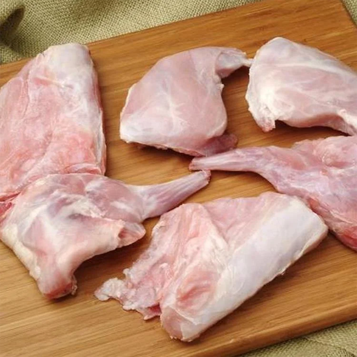 Fresh Rabbit by Tabi3y, available at Elmeraki, displayed ready for cooking with herbs and spices.