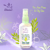 Tea Tree Toner by Divine Naturals, available at Elmeraki, displayed in a sleek bottle with fresh tea tree leaves and lavender sprigs.