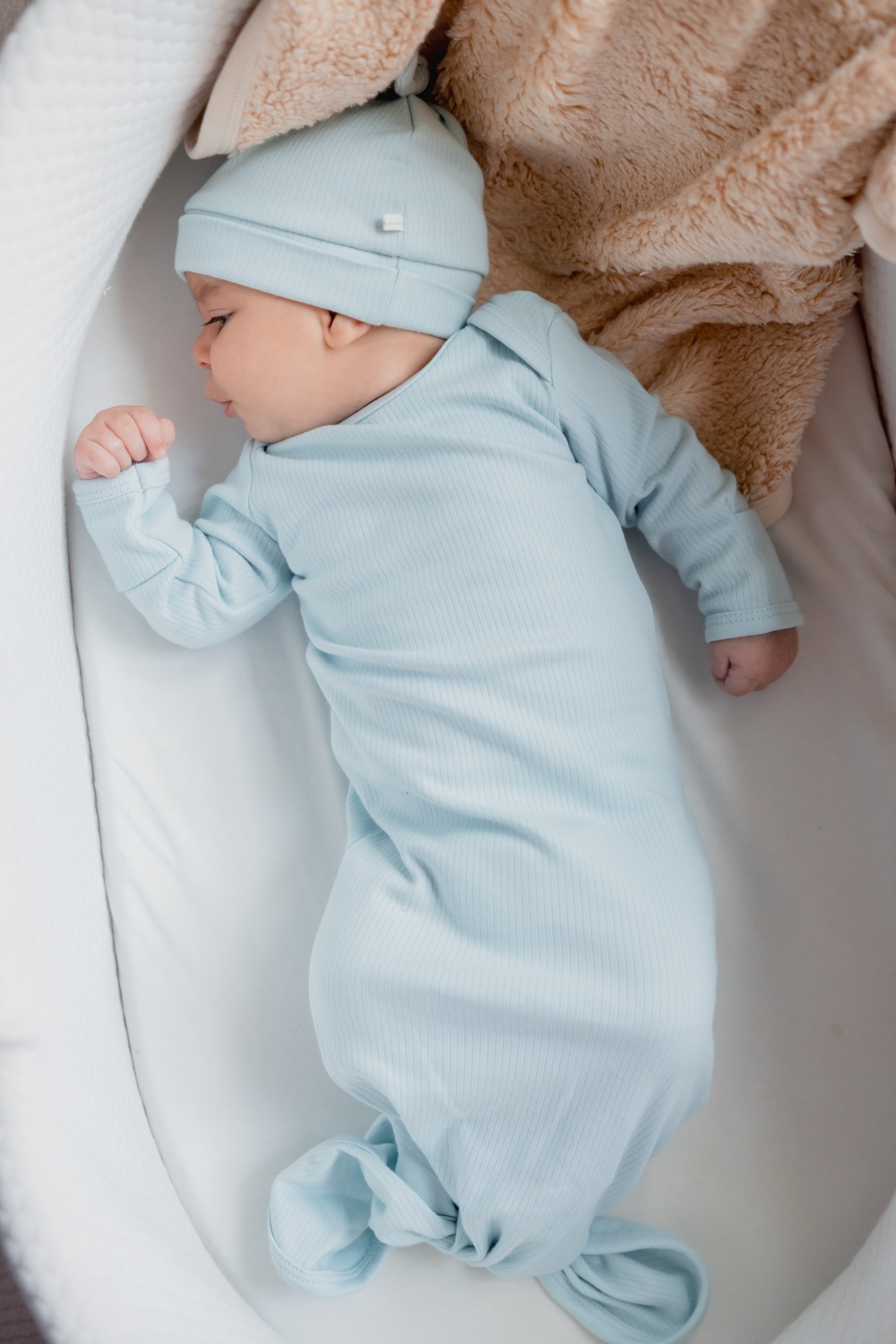  Under the Nile Pearl Blue Knotted Gown and Beanie Set for newborns.