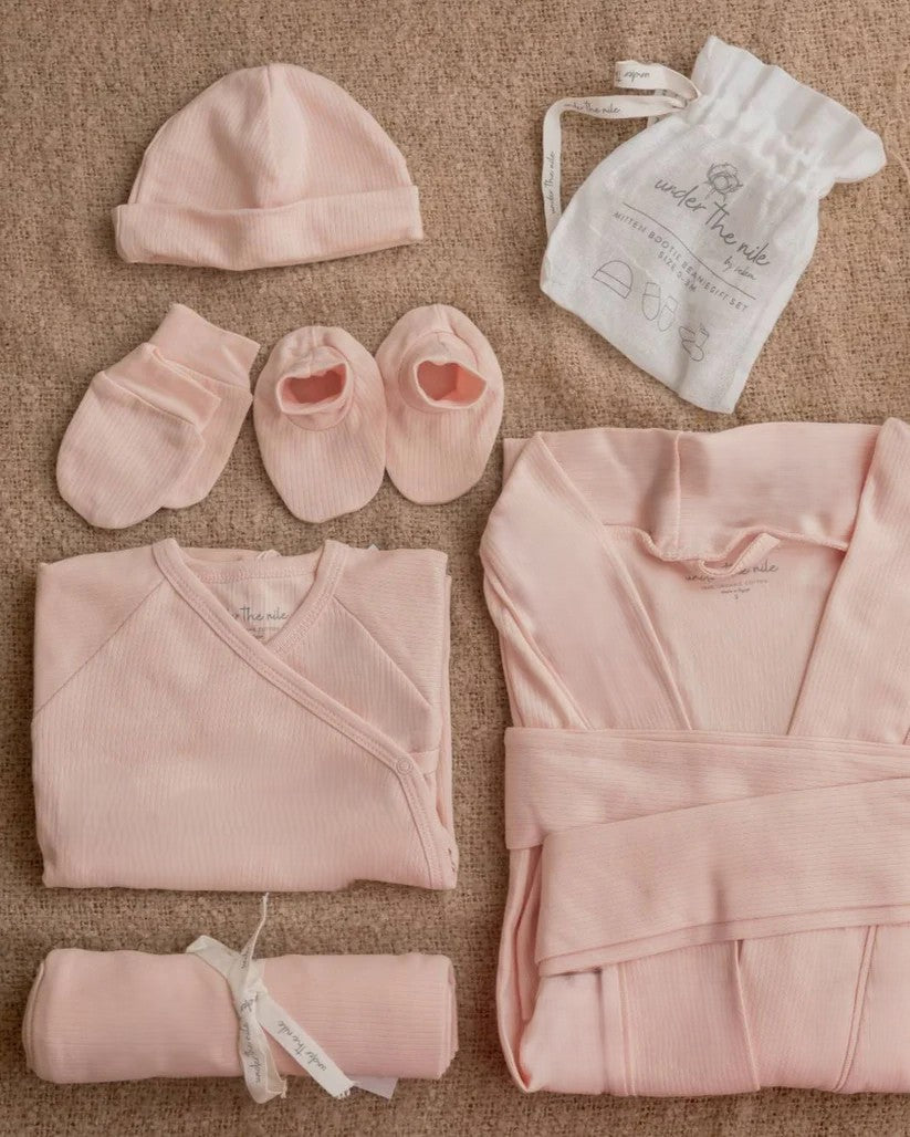  Under the Nile Mommy & Me Gift Set in delicate pink, featuring matching organic cotton items for mother and baby.