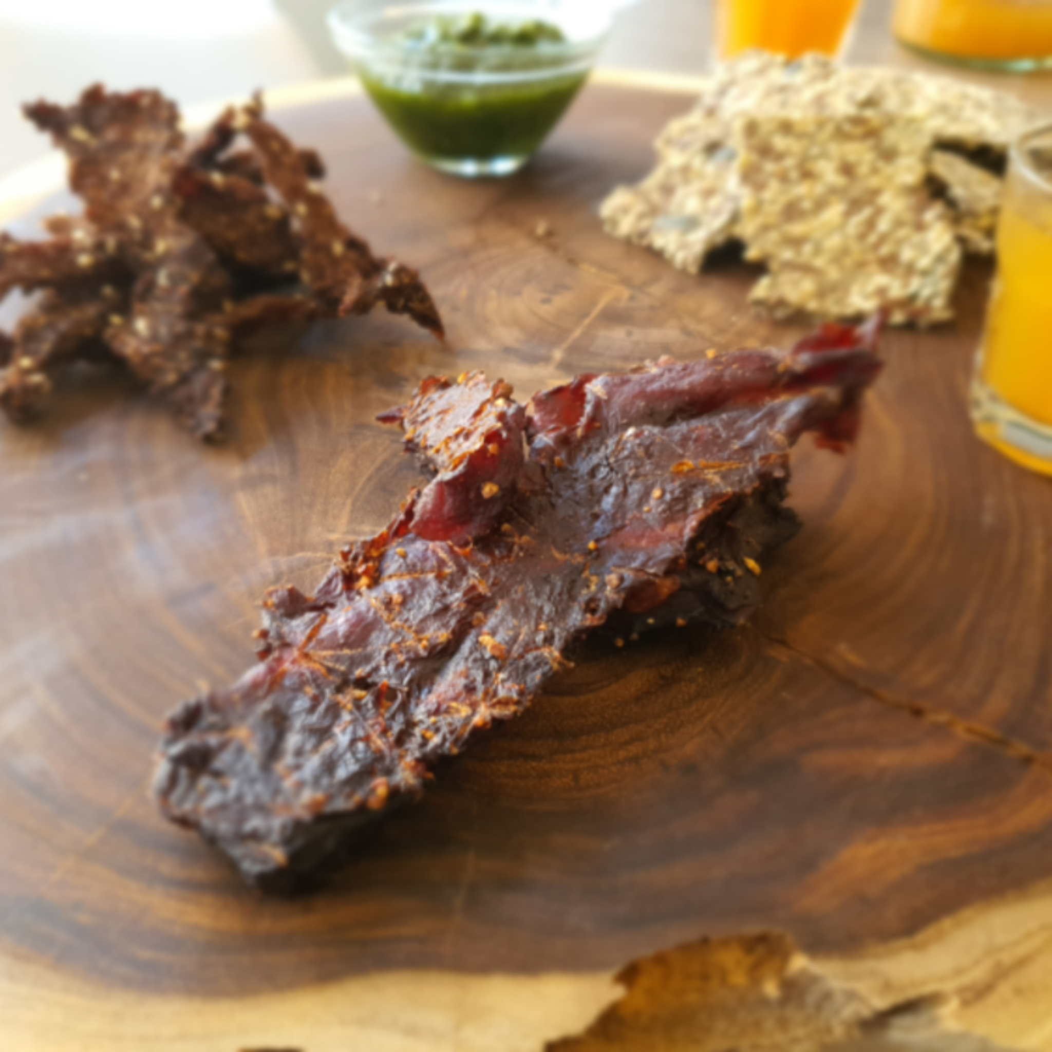 Beef Jerky from Good Gut Mama, available at Elmeraki, displayed in a pack with fresh herbs and spices