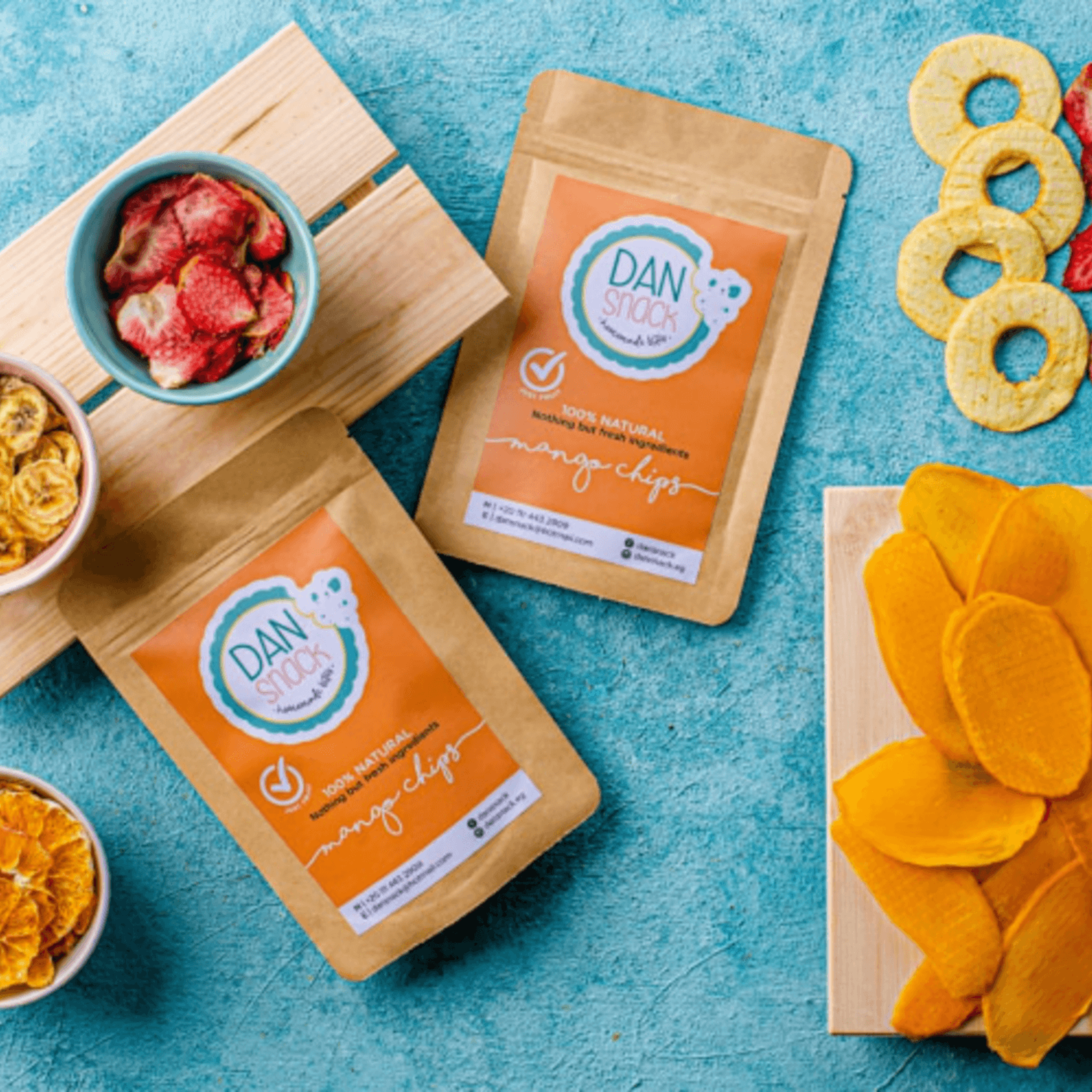 A pack of Dansnack Fruit Chips Mix with mango, pineapple, watermelon, and orange - a natural, dehydrated snack from Egypt.