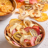 A pack of Dansnack Fruit Chips Mix with mango, pineapple, watermelon, and orange - a natural, dehydrated snack from Egypt.