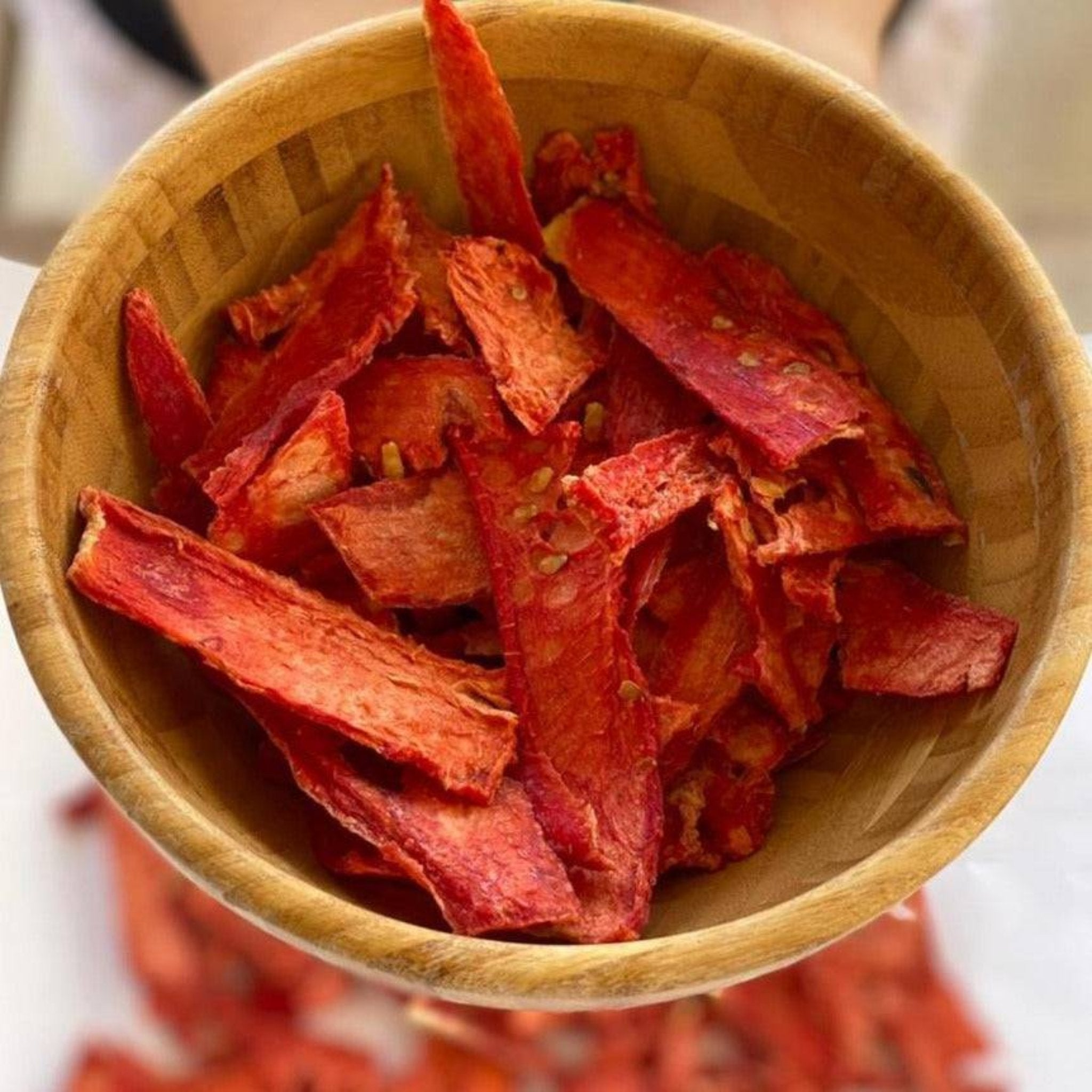 A pack of Dansnack Fruit Chips Mix with mango, pineapple, watermelon, and orange - a natural, dehydrated snack from Egypt.