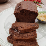 Flaxseed Nut-Free Bread from Good Gut Mama, available at Elmeraki, displayed on a wooden board with slices and seeds.