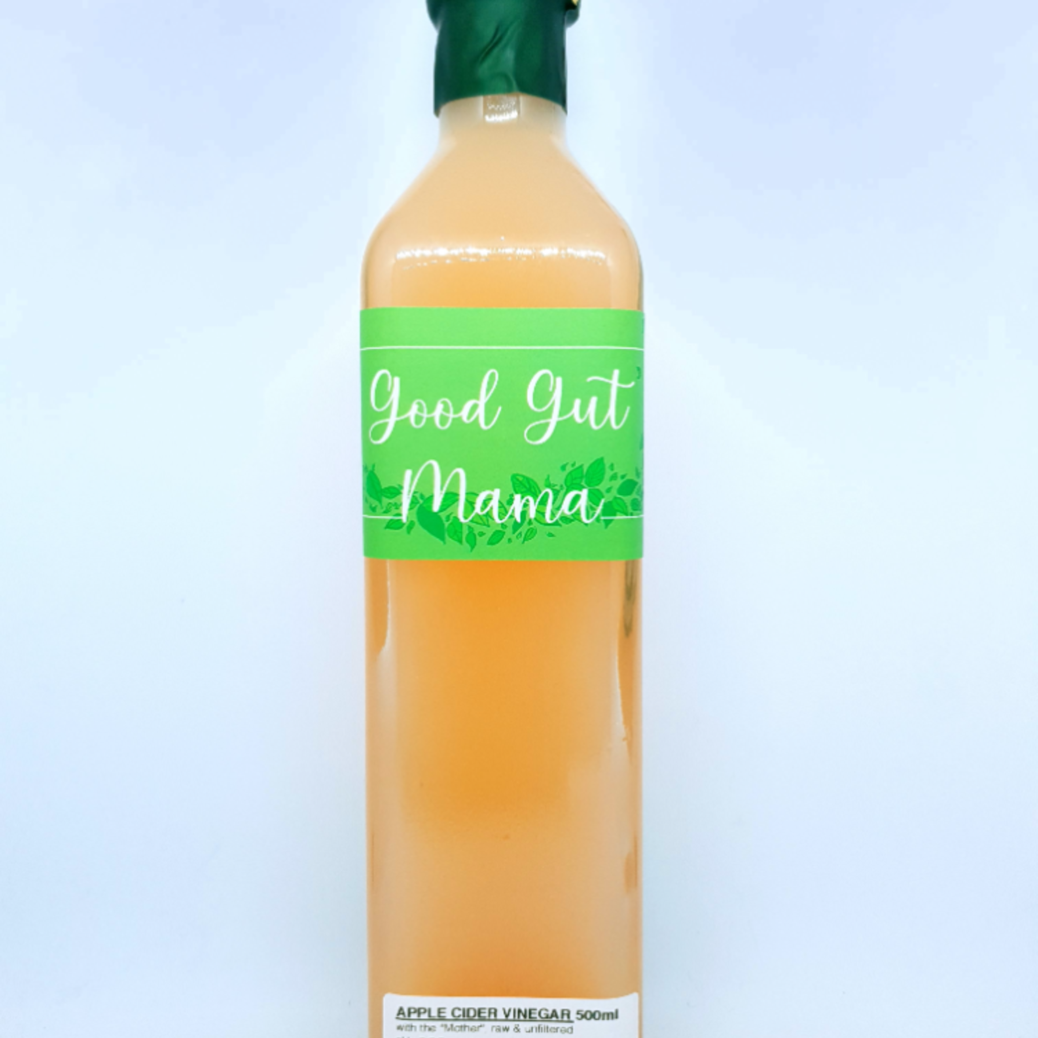 Bottle of Good Gut Mama Raw Unfiltered Apple Cider Vinegar with the "mother" from Egypt, showing its natural, cloudy sediment.