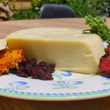 Good Gut Mama Vegan Mozzarella Cheese from Egypt, showing a creamy, meltable plant-based cheese block